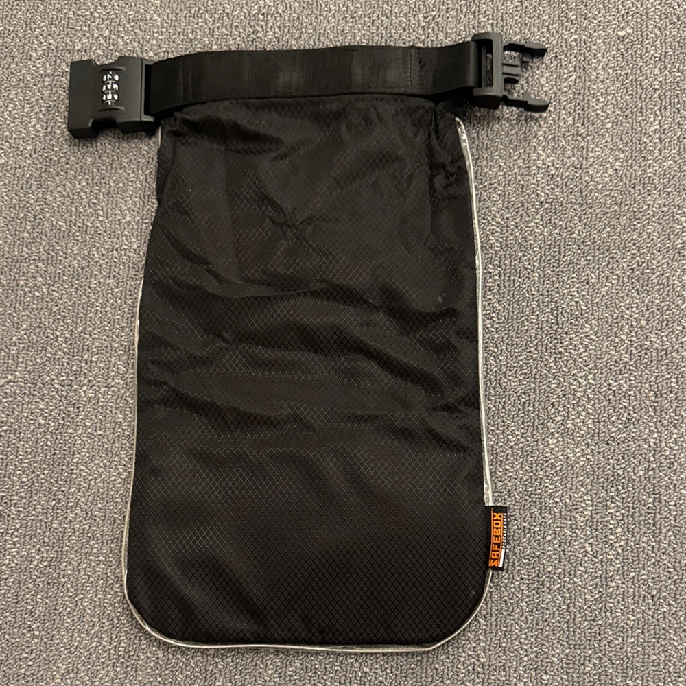 Safebox portable Black Packable Travel bag and Antitheft with combination lock.